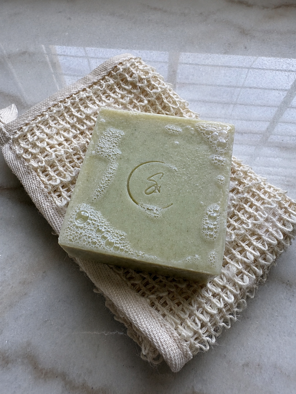 Refreshing artisan cucumber soap with creamy lather and nourishing botanical oils.