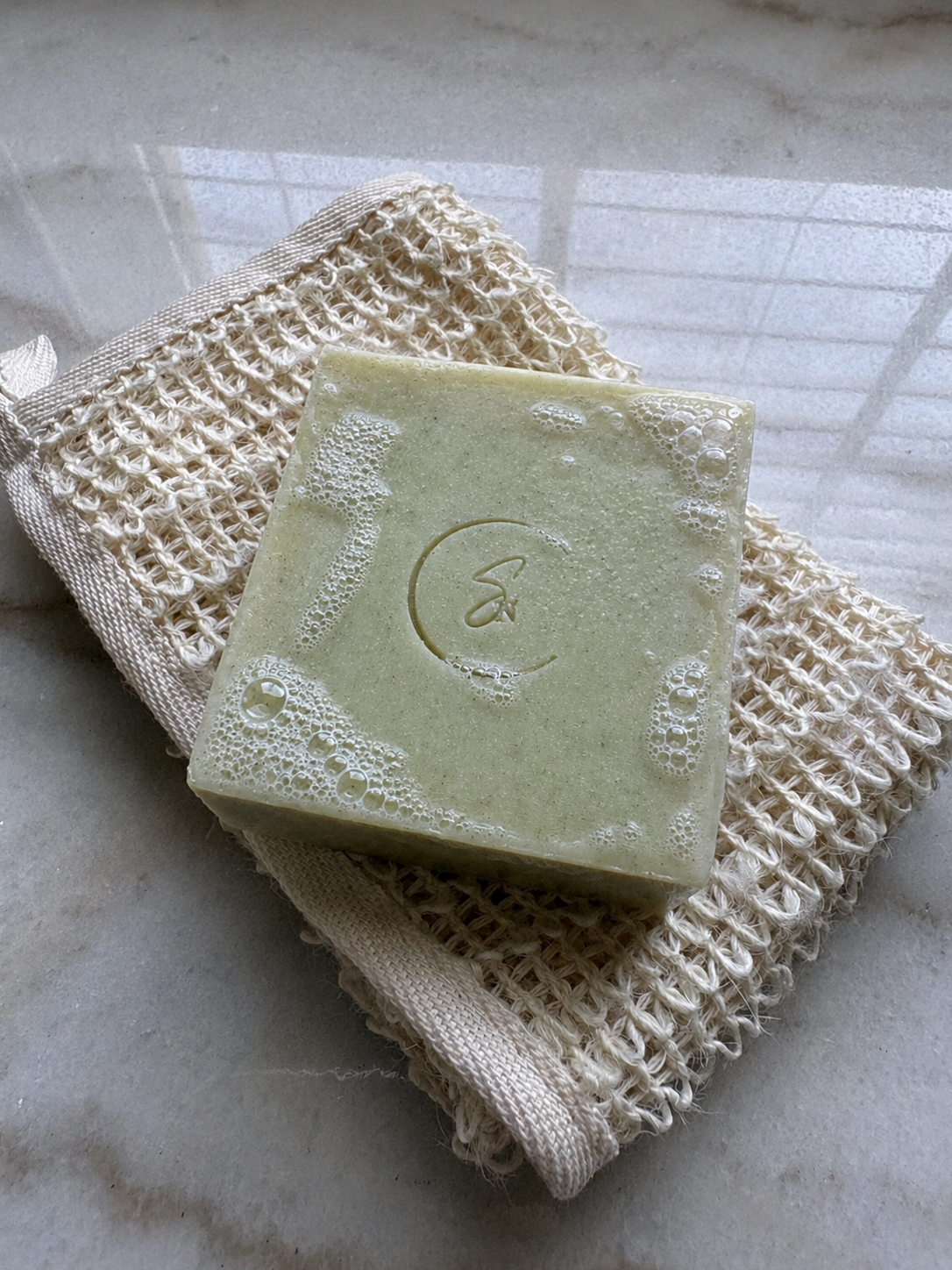 Refreshing artisan cucumber soap with creamy lather and nourishing botanical oils.
