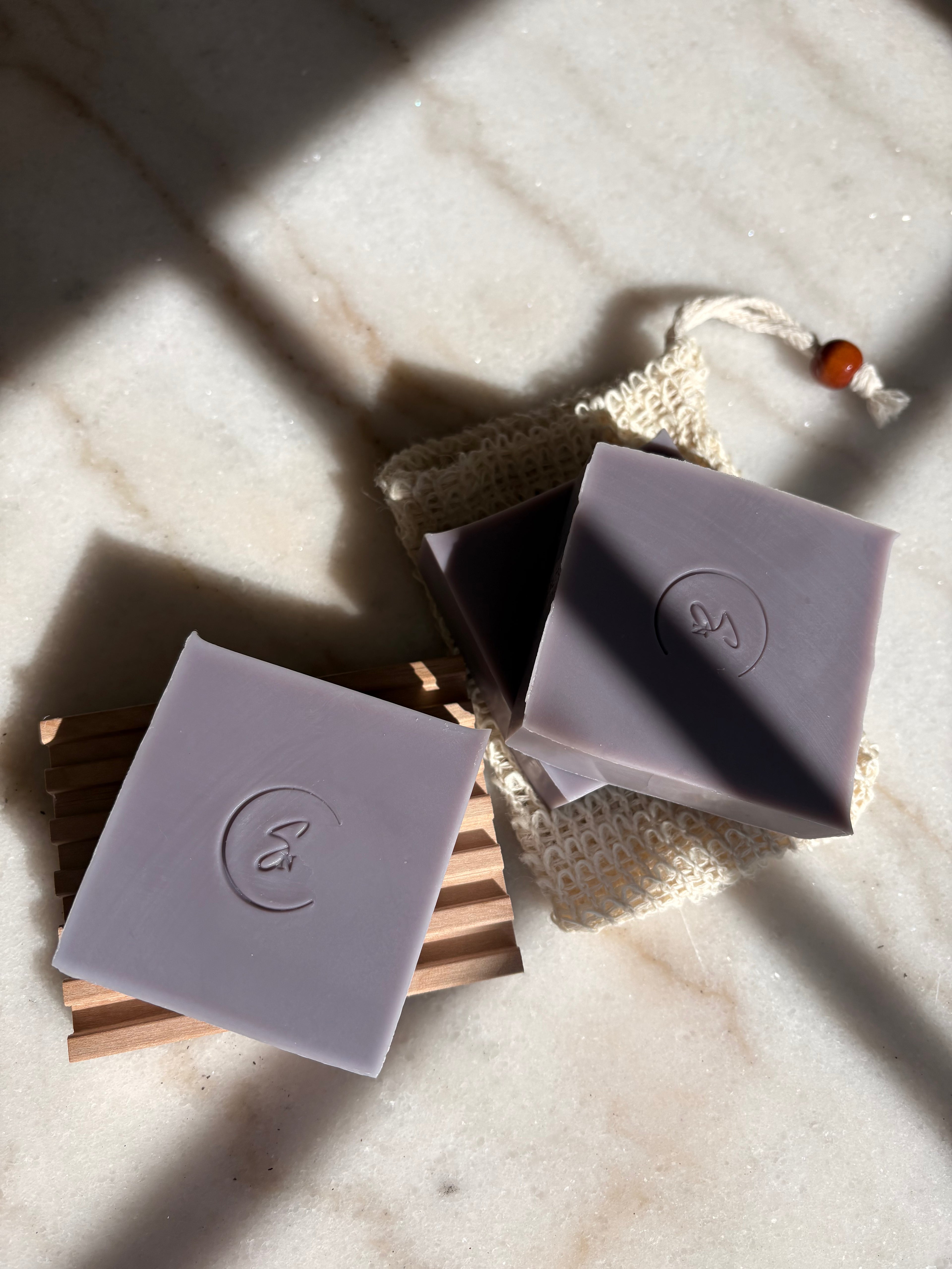 Close-up of gromwell root beauty bar showing natural botanical infusion