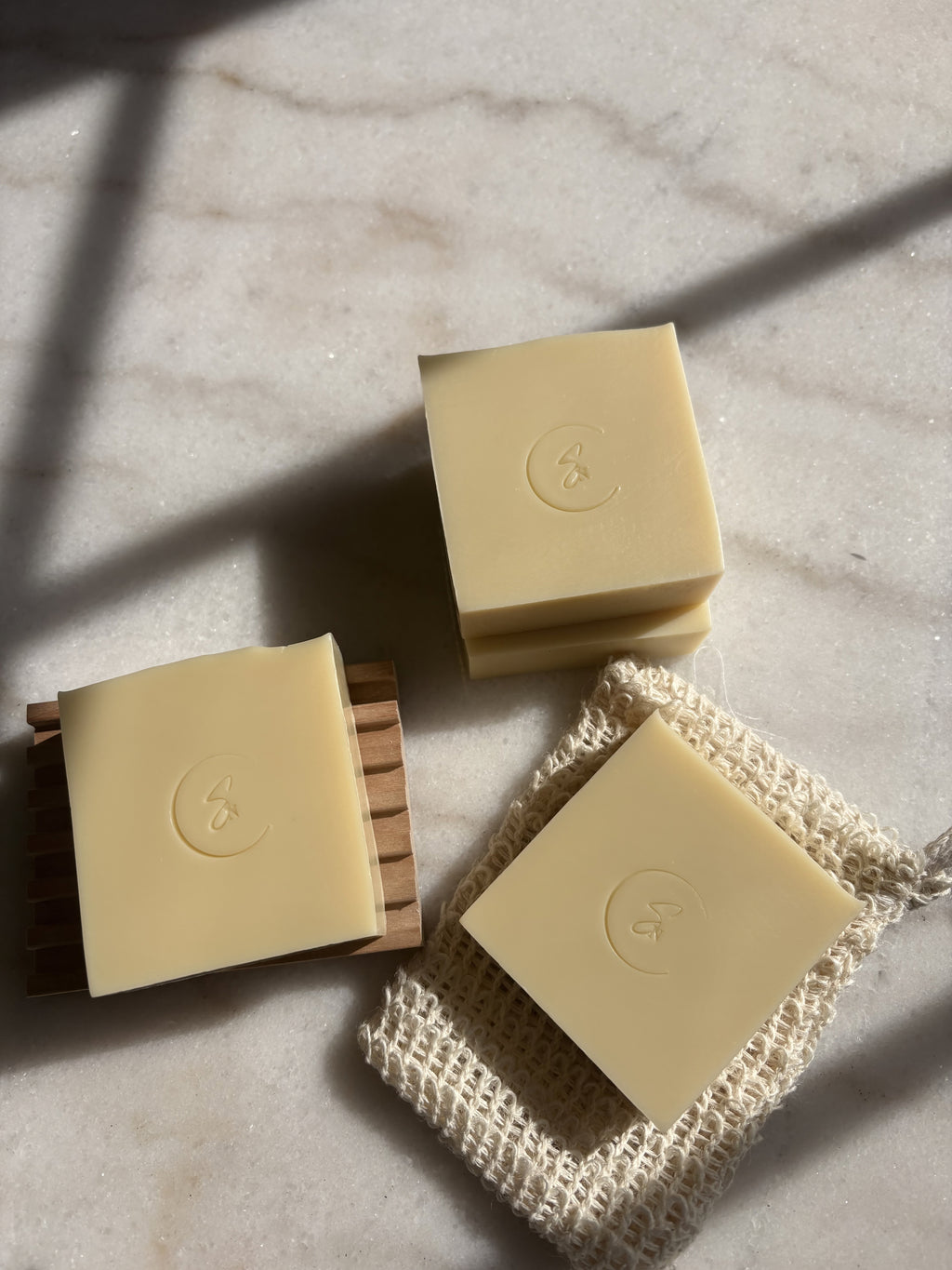 Natural handmade soap with wooden soap dish and sisal saver bag