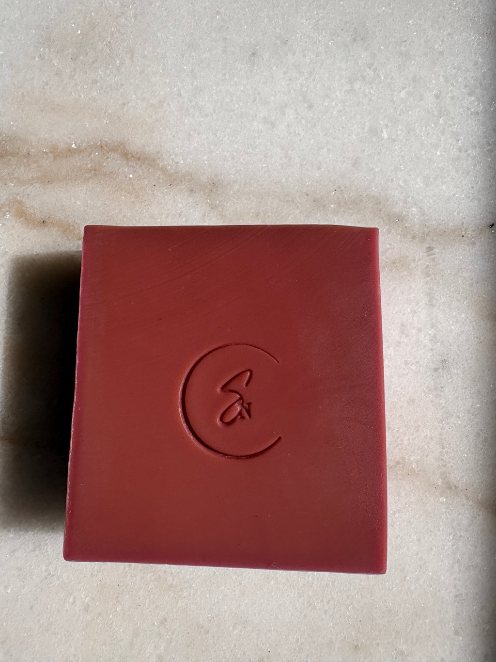 Close-up of rhubarb botanical soap showing natural plant-based color