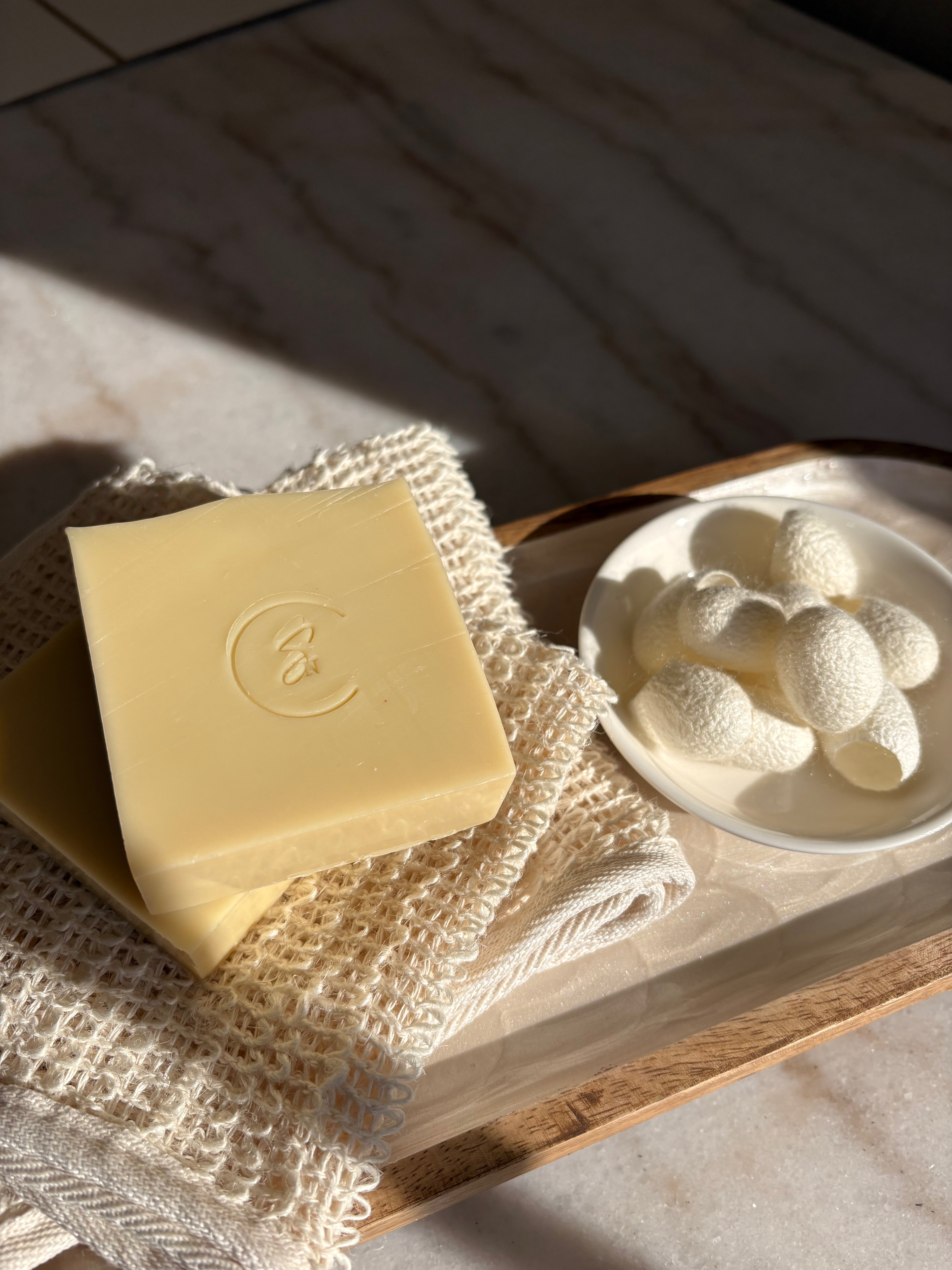 Silk protein beauty bar showing smooth texture and creamy lather, handmade soap