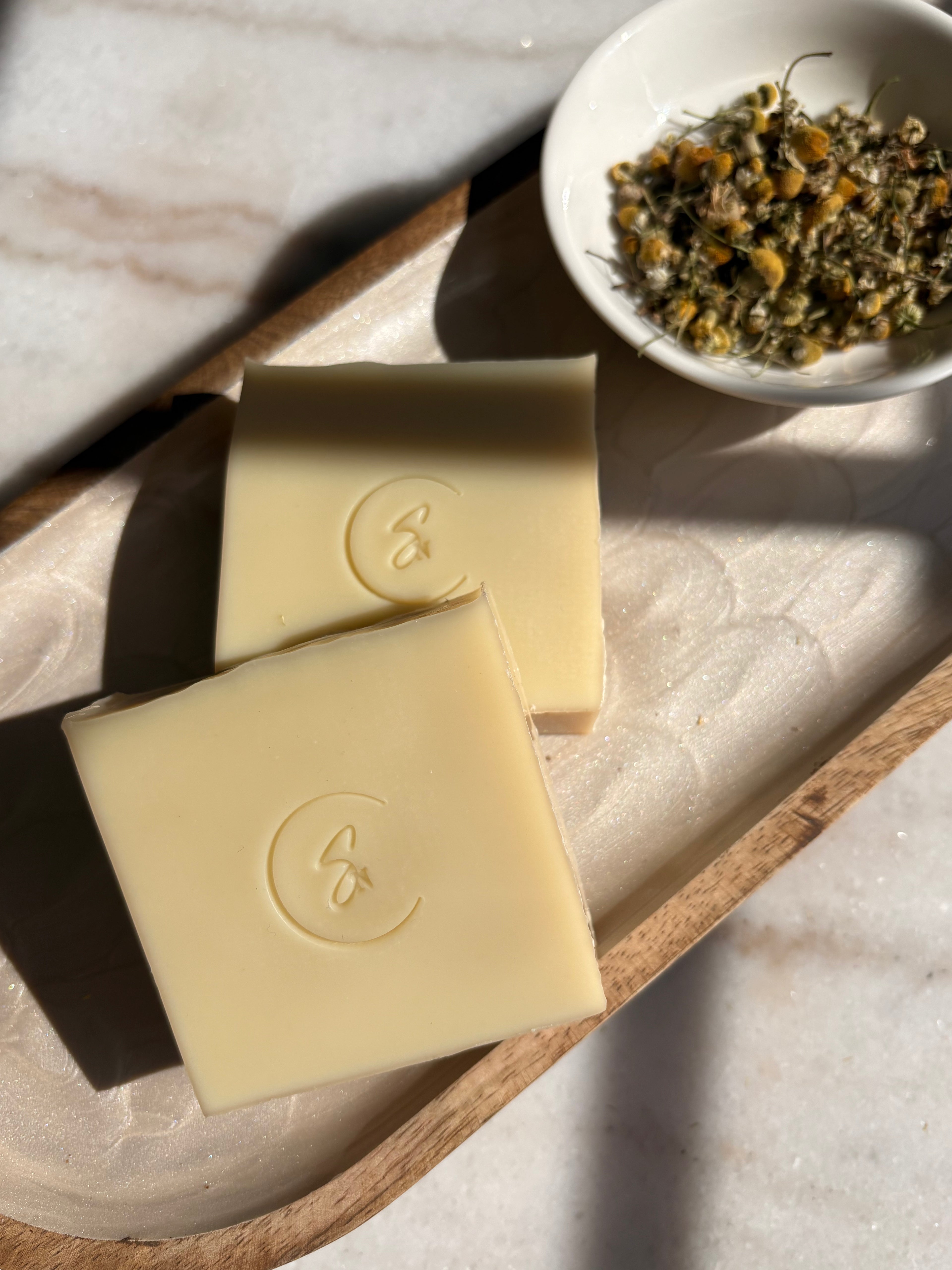 Golden-hued artisan Chamomile soap bar infused with real botanical petals. Chamomile botanical beauty bar handmade soap for sensitive skin
