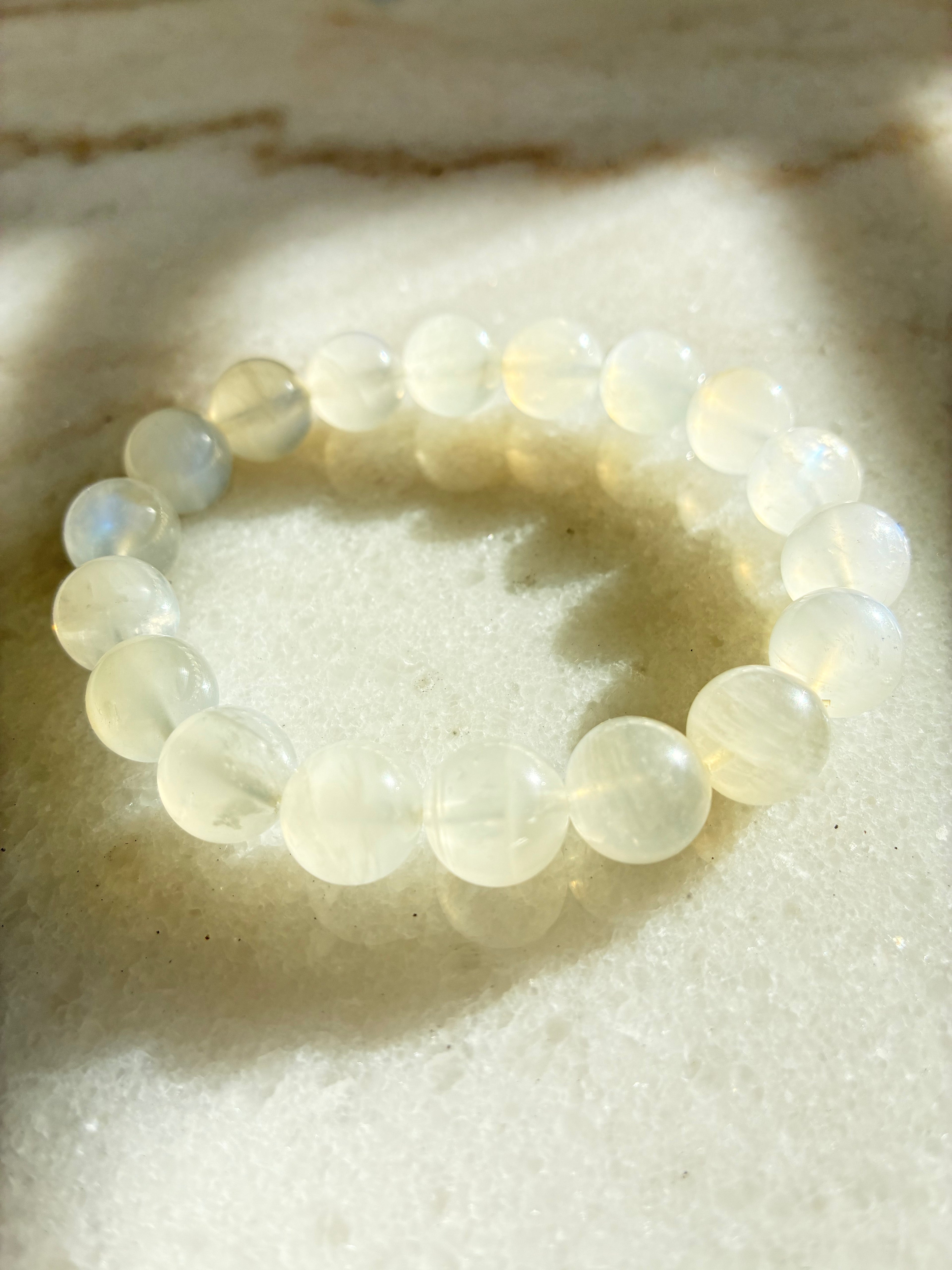 translucent beaded bracelet on a textured surface