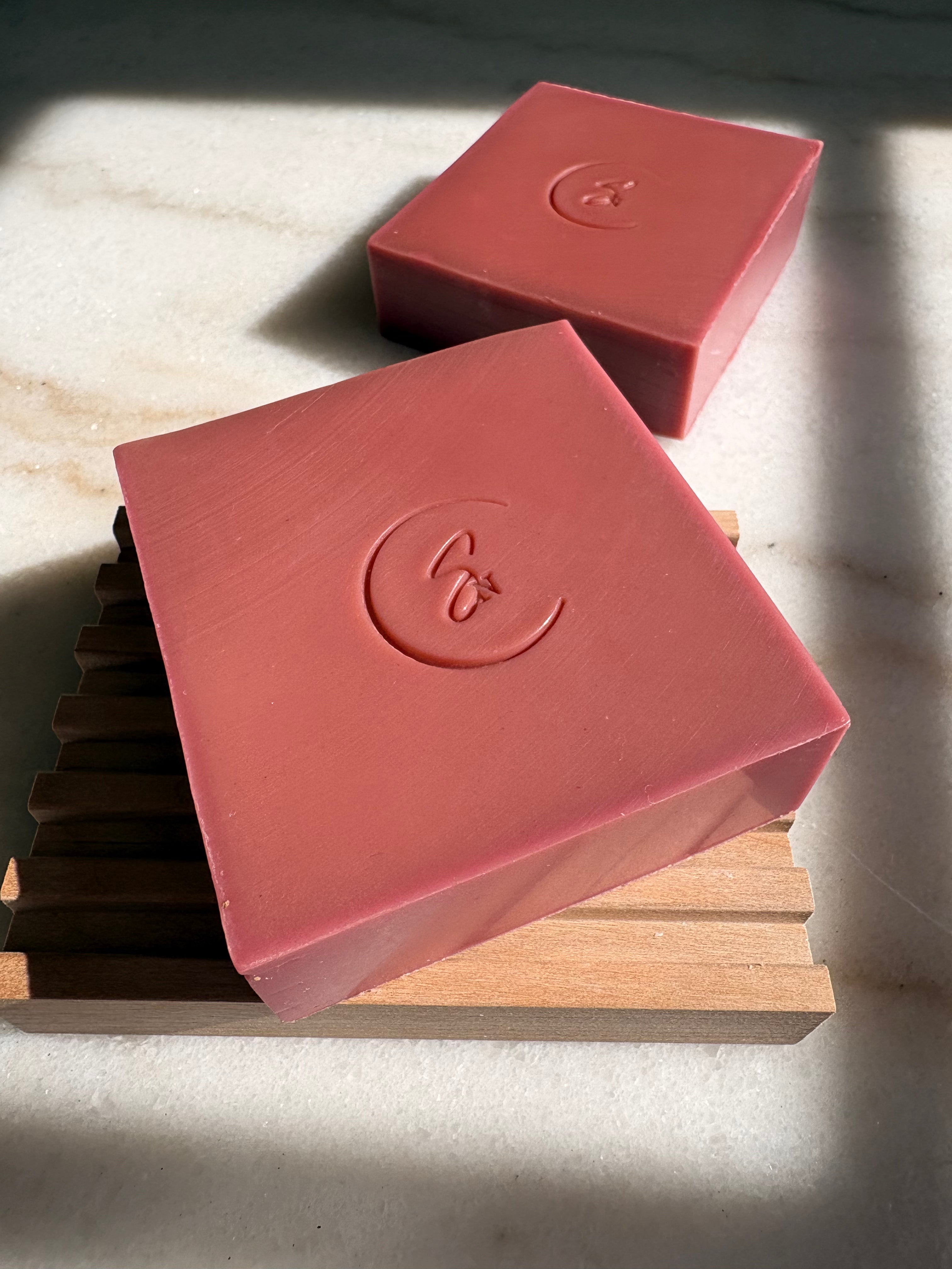 Handmade rhubarb and madder root soap styled in minimalist setting