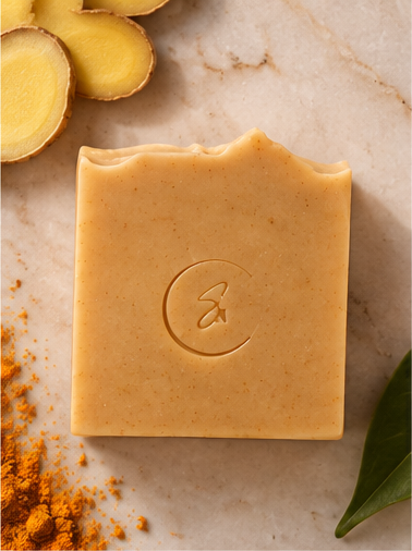 Overhead view of Golden Ginger artisan soap featuring a warm golden color and minimalist presentation.