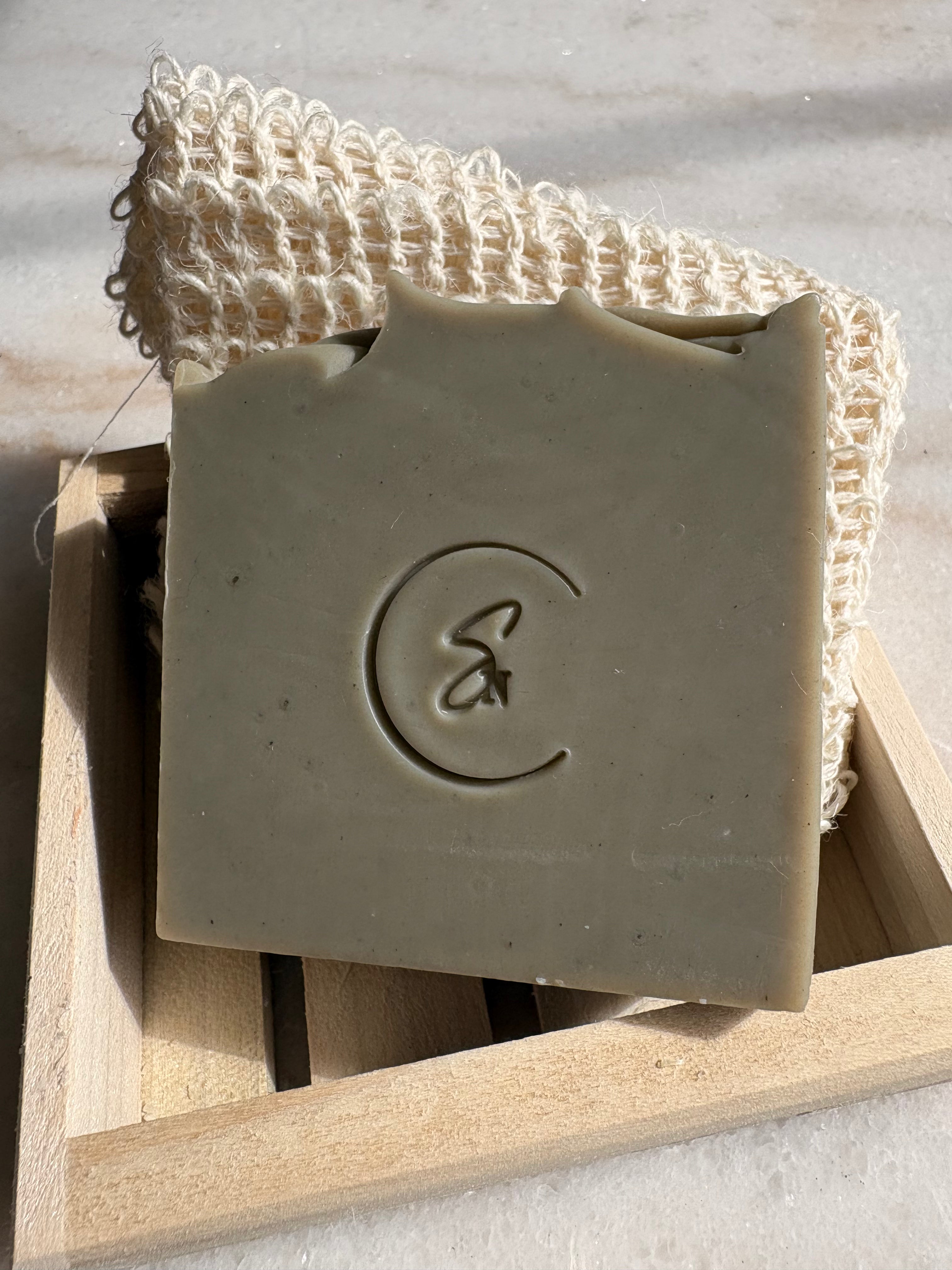 Mineral-rich green clay soap styled in minimalist setting