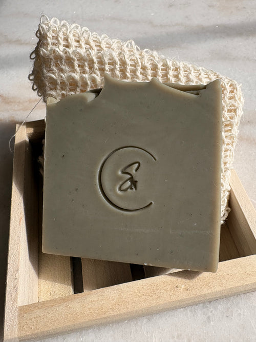 Mineral-rich green clay soap styled in minimalist setting